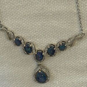 D'Joy sterling silver pendant necklace featuring opals.worn once. Adjustable.